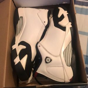 A pair of white and black retro 14 size 7
